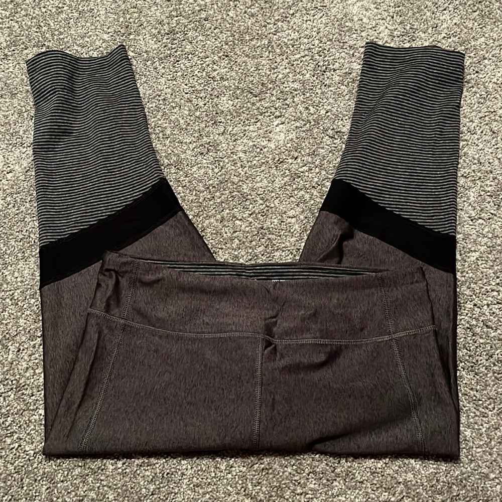 Under Armour dark gray with black strip leggings